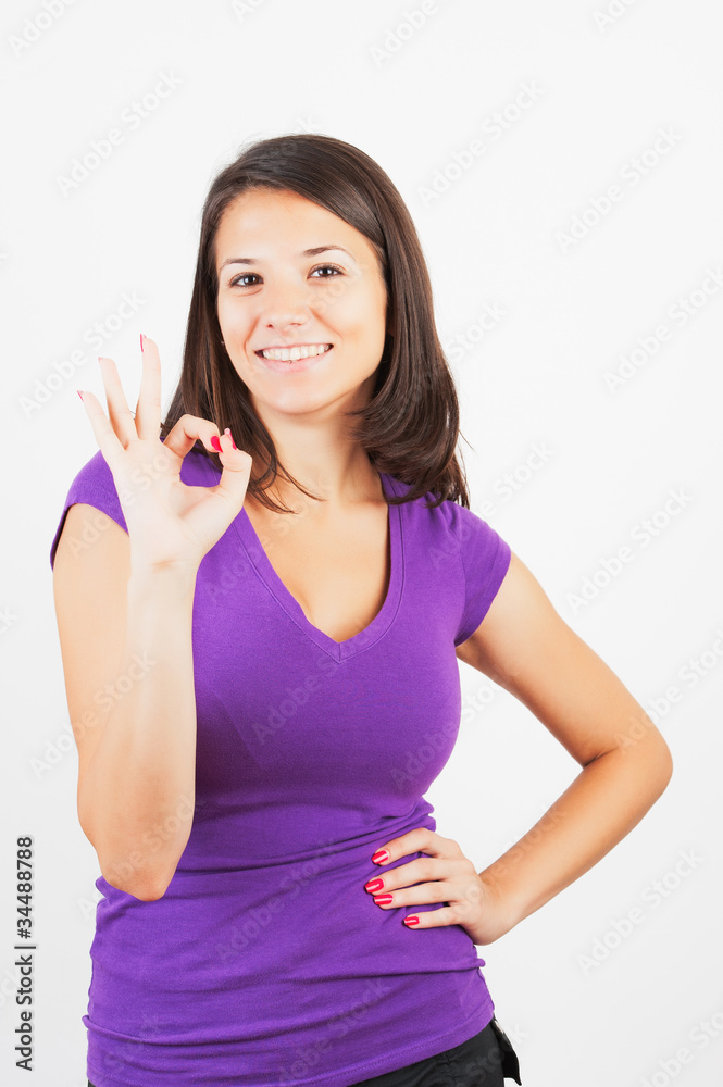 Portrait of smiling woman with okay gesture Portrait of smiling woman with okay gesture