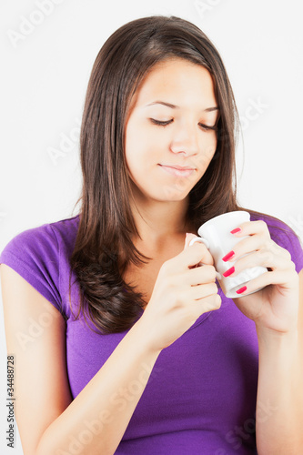 Beautiful Young Woman drinking Coffee.