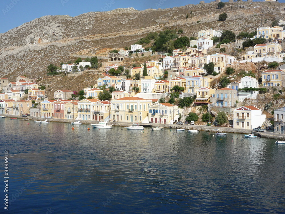 Simi town houses and Mediterranean sea a Greek holiday island	