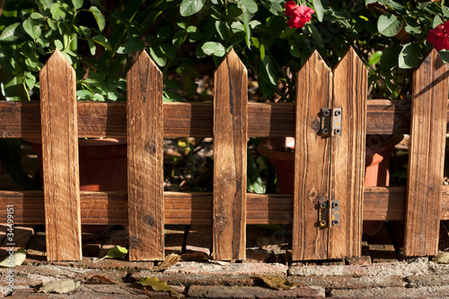 Fototapeta Naklejka Na Ścianę i Meble -  wooden fence at garden under sunshine