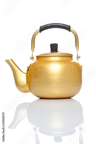 Old gold teapot isolated on the white background