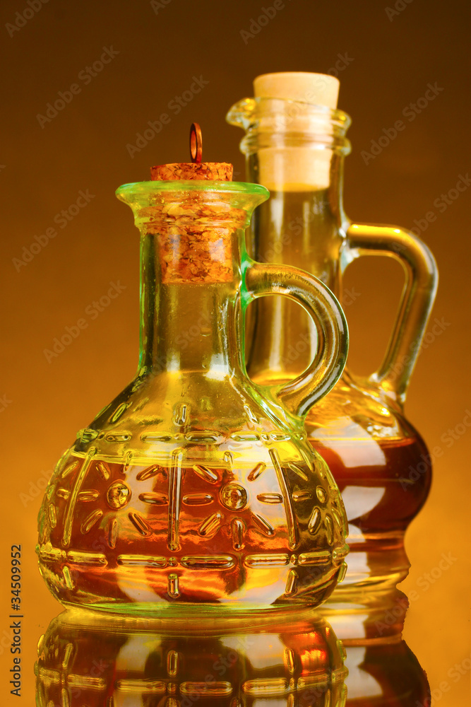 jar with olive oil on a yellow background jar with olive oil on a yellow background
