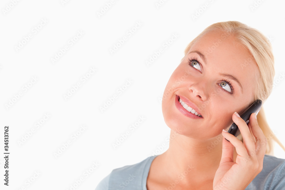 Smiling blond woman on the phone Smiling blond woman on the phone