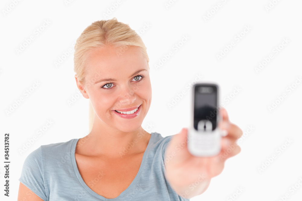 Smiling woman showing a mobile Smiling woman showing a mobile