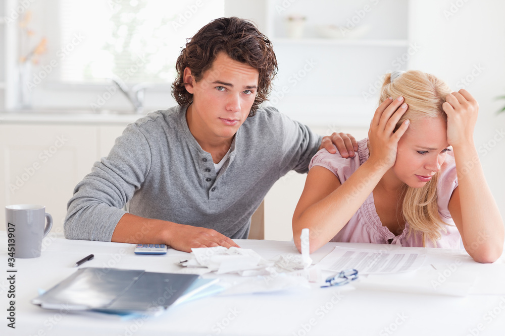 Sad couple doing their accounts