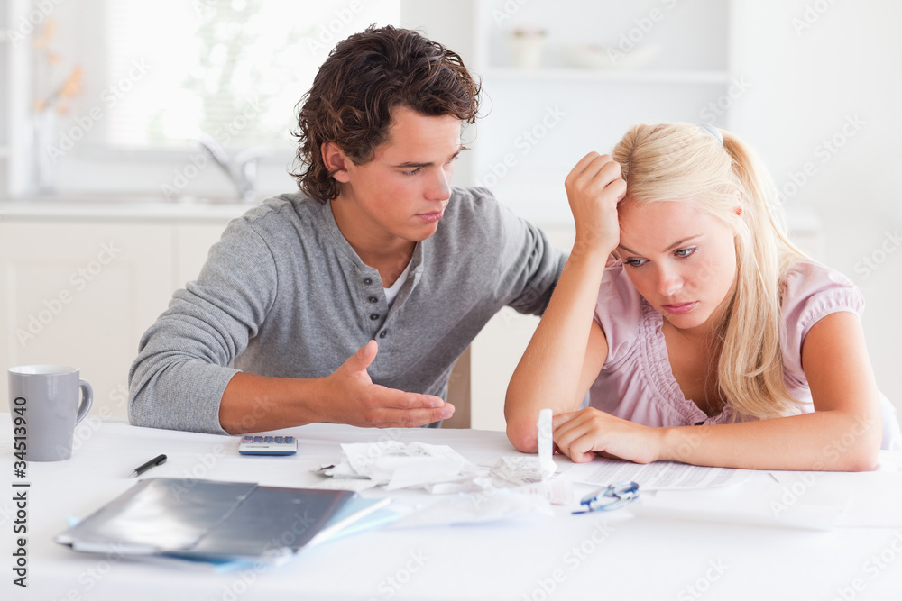 Arguing couple at a table Arguing couple at a table