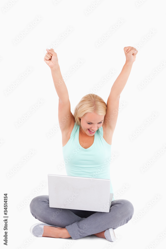 Joyful blond woman with a laptop Joyful blond woman with a laptop