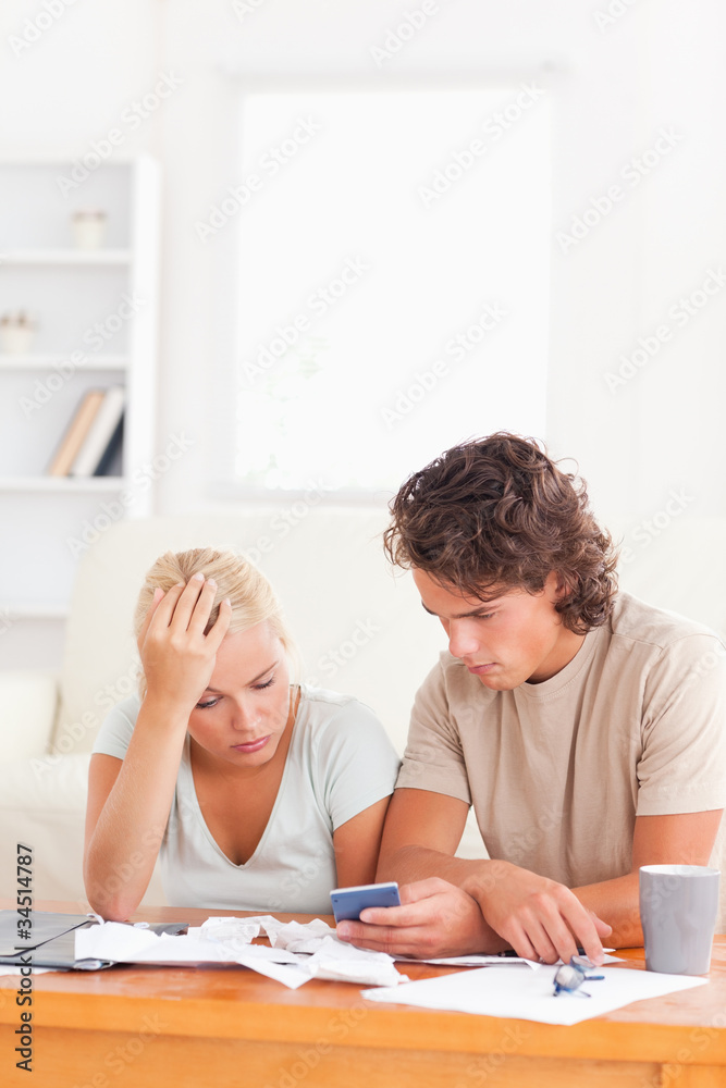 Worried couple doing home accounts. Worried couple doing home accounts.