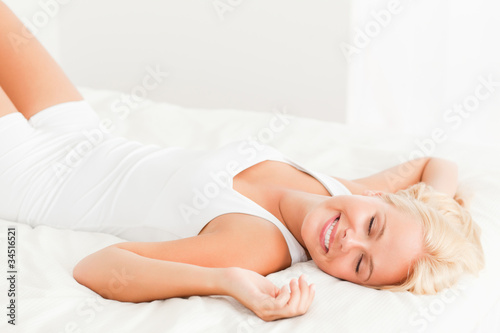 Smiling woman lying on her back