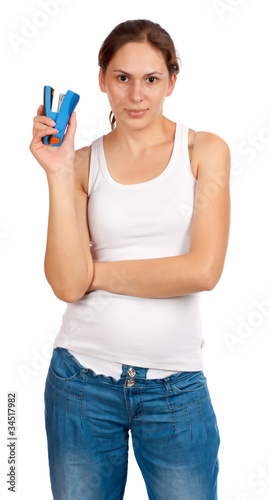 Фотография Woman with a stapler, isolated over white background
