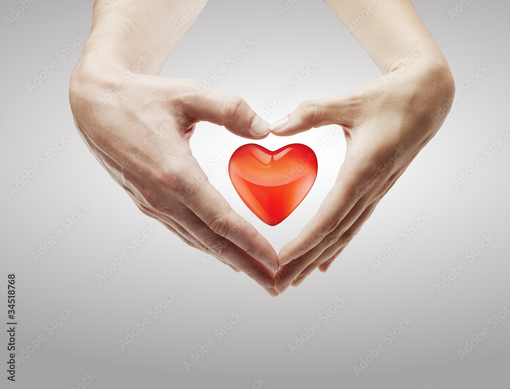 Fototapeta premium Heart shape made of female and male hands together