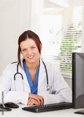 Female doctor smiling in office