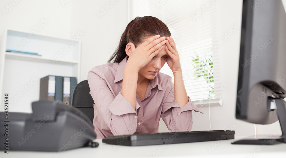 Frustrated businesswoman in office Frustrated businesswoman in office