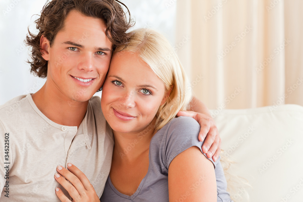Lovely couple sitting on a couch Lovely couple sitting on a couch