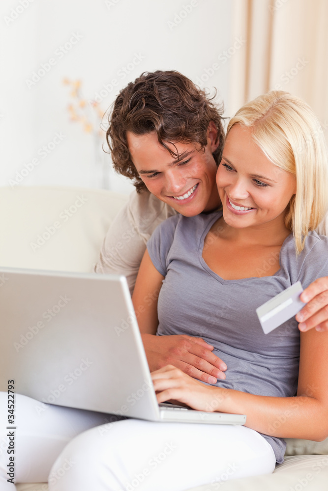 Portrait of a lovely couple shopping online Portrait of a lovely couple shopping online