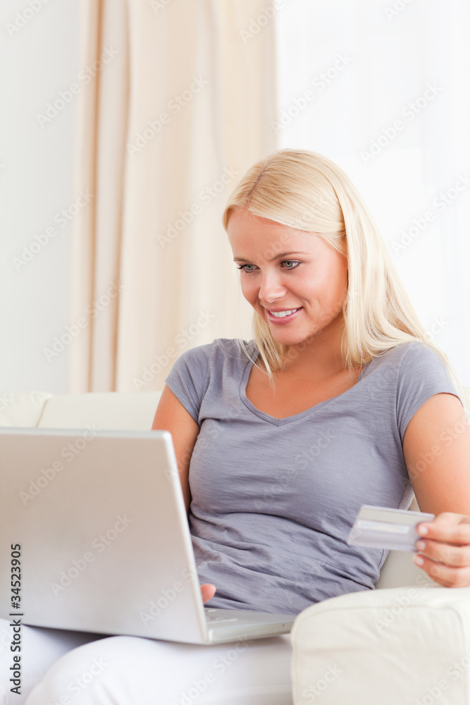 Portrait of a gorgeous blonde woman shopping online Portrait of a gorgeous blonde woman shopping online