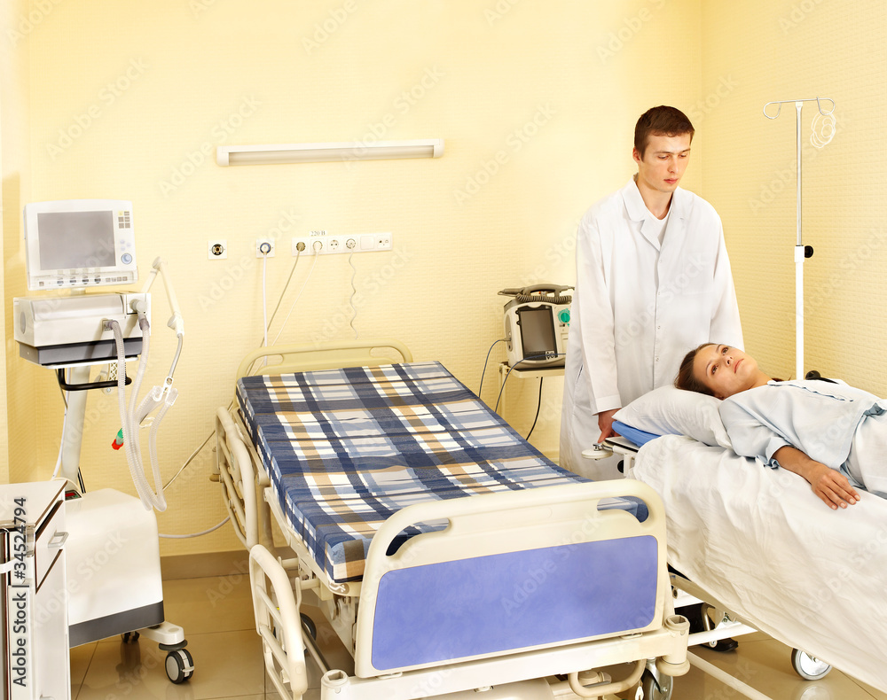 Woman on gurney in operating room. Woman on gurney in operating room.