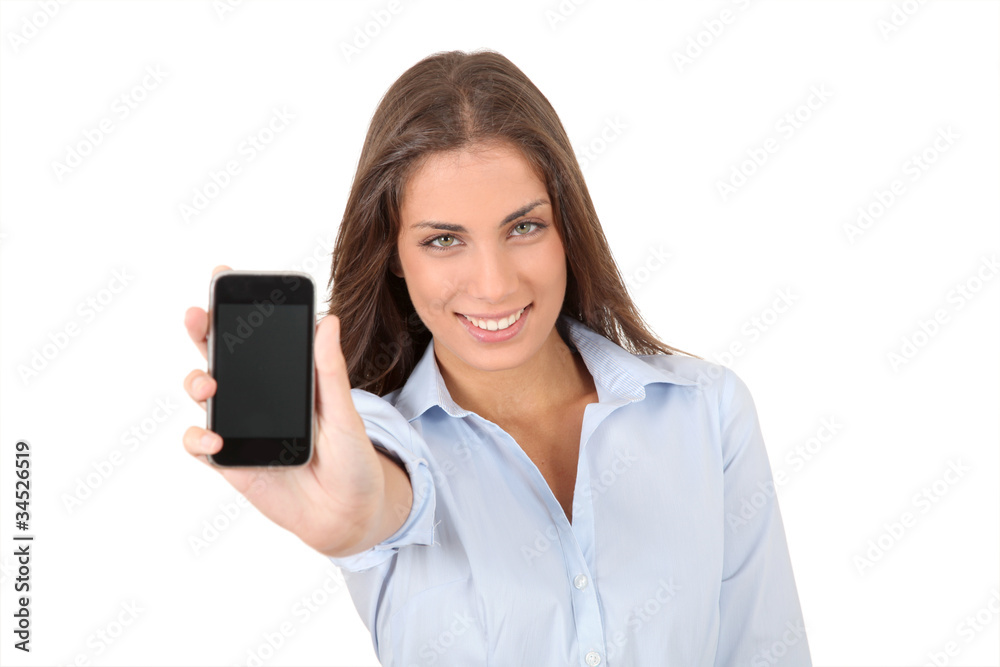 Portrait of beautiful young woman holding smartphone