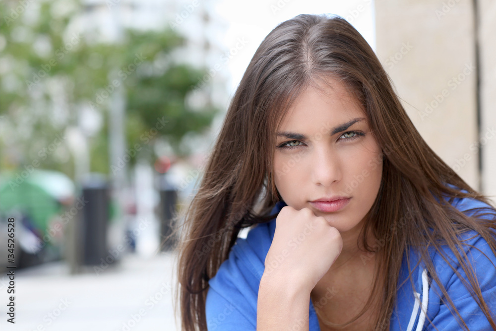 Portrait of teenager sitting in the street Portrait of teenager sitting in the street