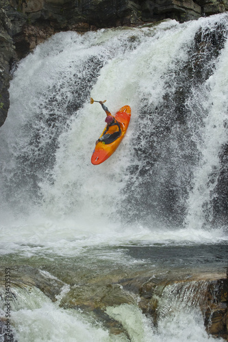 Kayaker in the waterfall © Chudakov