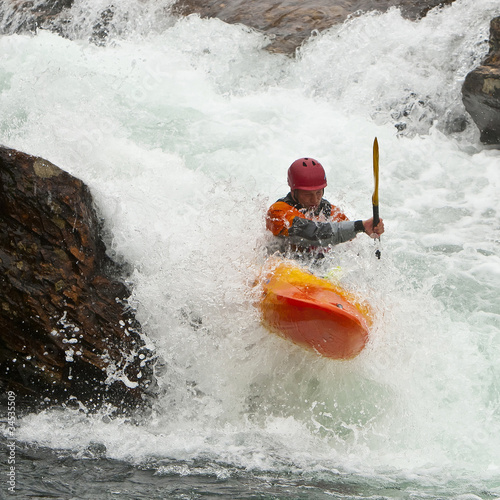 Kayaker in the waterfall photo