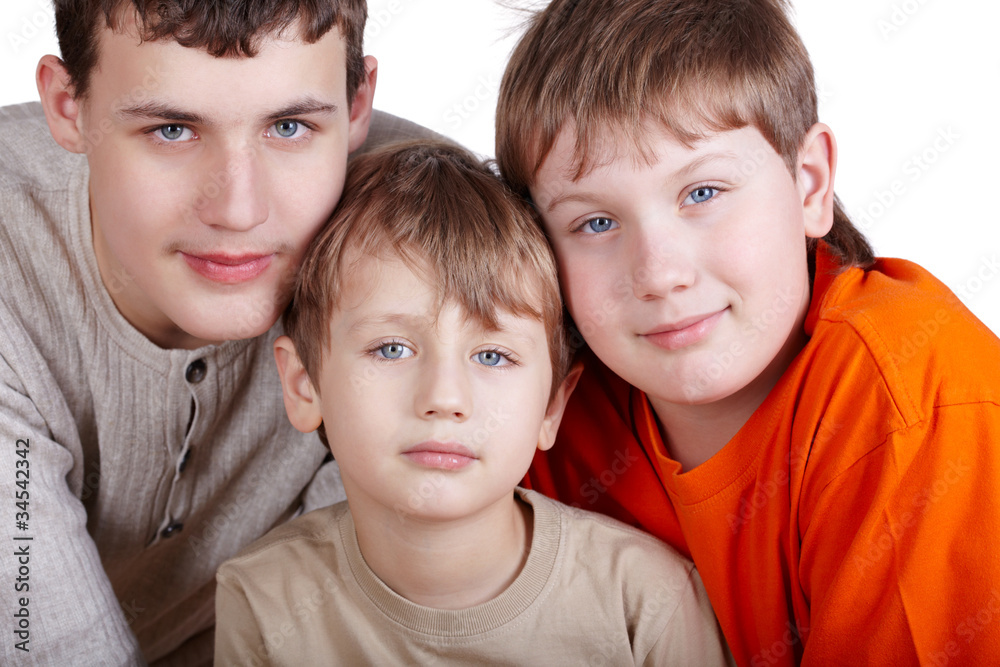 Close-up poprtrait of three boys of different ages. Close-up poprtrait of three boys of different ages.