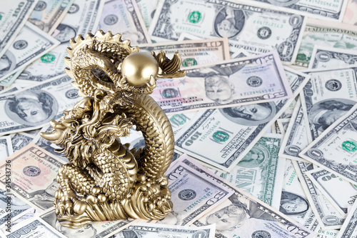 Gold dragon, symbol of 2012 year against dollars