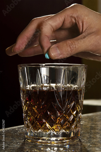 spiking a drink with a drug (Ruffee, Rohypnol)