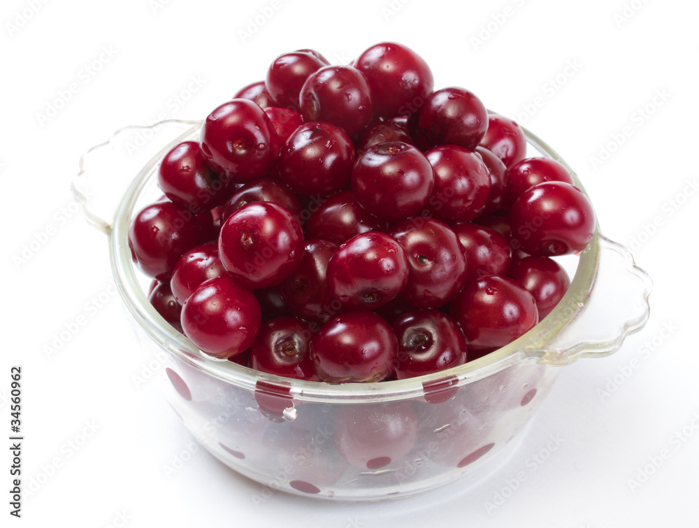 Bowl with ripe cherries. Isolated on a white background. Bowl with ripe cherries. Isolated on a white background.