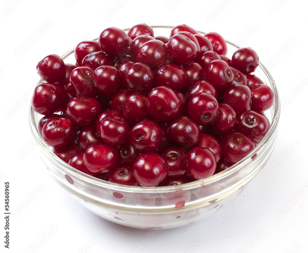 Bowl with ripe cherries. Isolated on a white background. Bowl with ripe cherries. Isolated on a white background.
