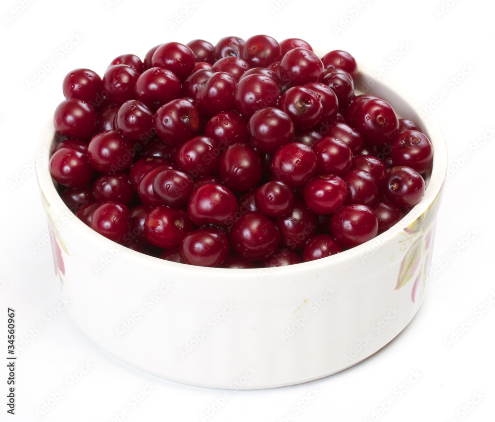 Bowl with ripe cherries. Isolated on a white background. Bowl with ripe cherries. Isolated on a white background.