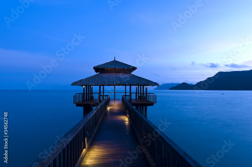 Building at the end of a jetty during twilight
