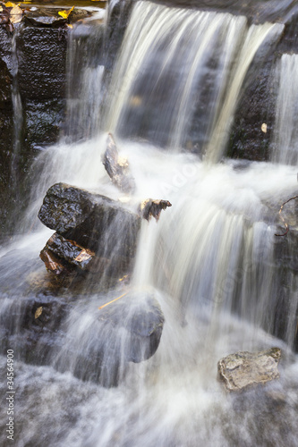 Waterfall with autumn leaves