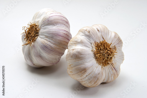 Two closeup garlic on white