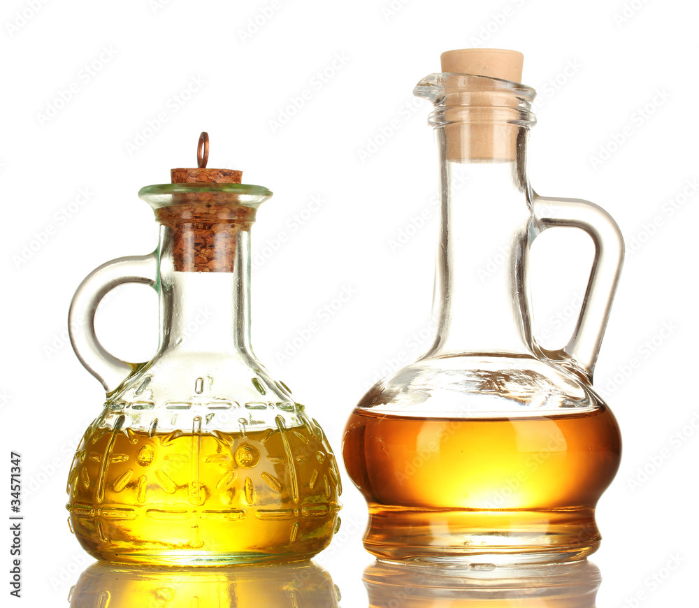 two jars with the oil isolated on white two jars with the oil isolated on white