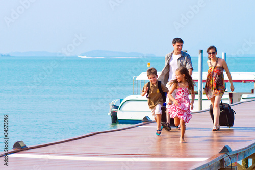 A young and attractive family with their luggages.