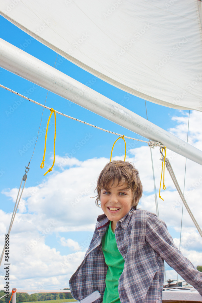boy sailing on yacht, Trakai, Lithuania boy sailing on yacht, Trakai, Lithuania