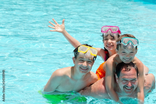 Family in pool © Marzanna Syncerz