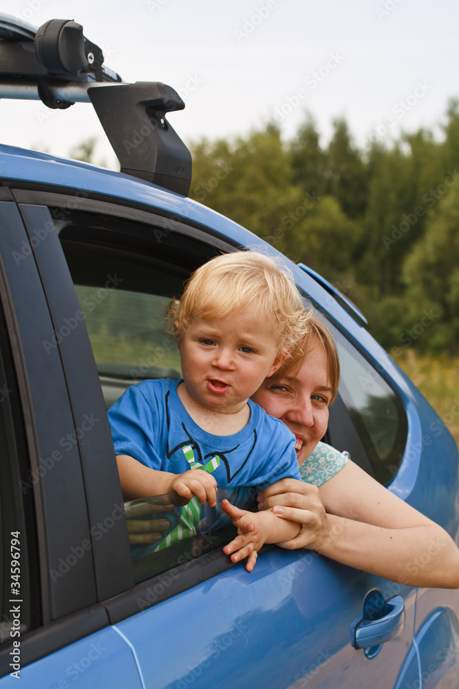 Happy baby looking from car window Happy baby looking from car window