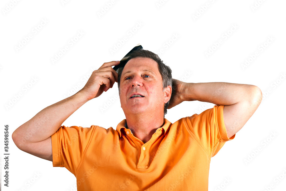 Naklejka premium attractive man combing his hair