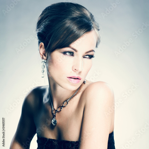 Beautiful woman with evening make-up. Jewelry and Beauty #34601317