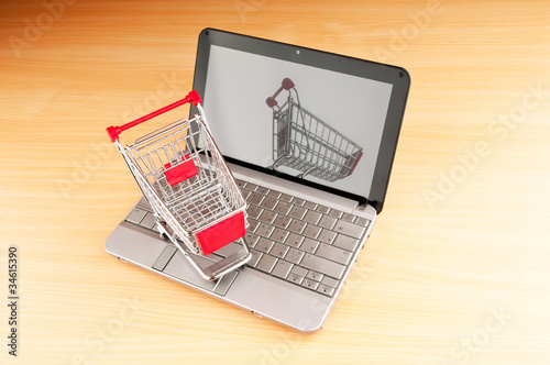 Internet online shopping concept with computer and cart