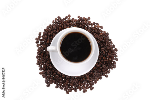 Coffee beans with mug isolated on the white background