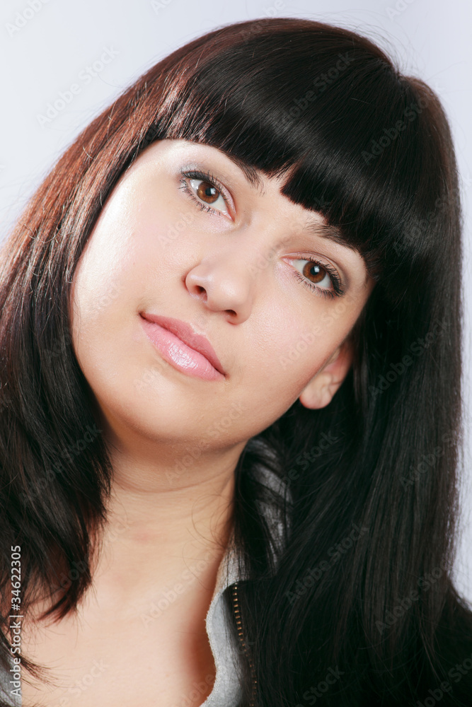 Naklejka premium Beautiful Young Brunette Woman on White.