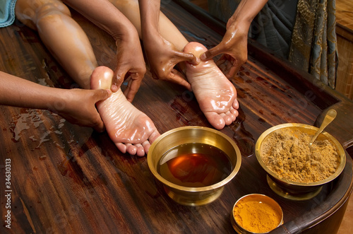 traditional indian ayurvedic oil foot massage photo