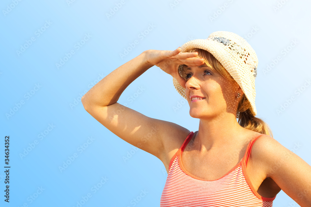 Woman looking away - isolated over blue background Woman looking away - isolated over blue background