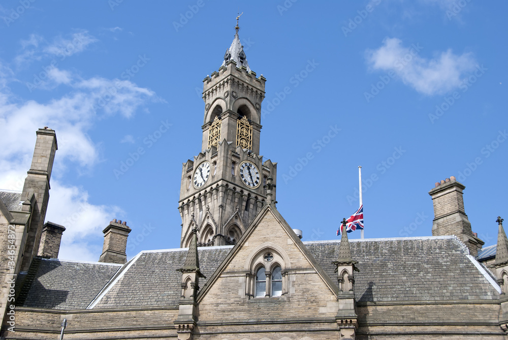 A Union Jack flying over an English town hall