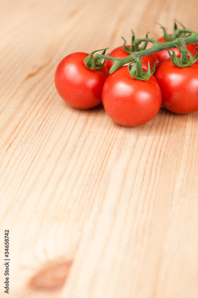 Tomatoes on wooden board