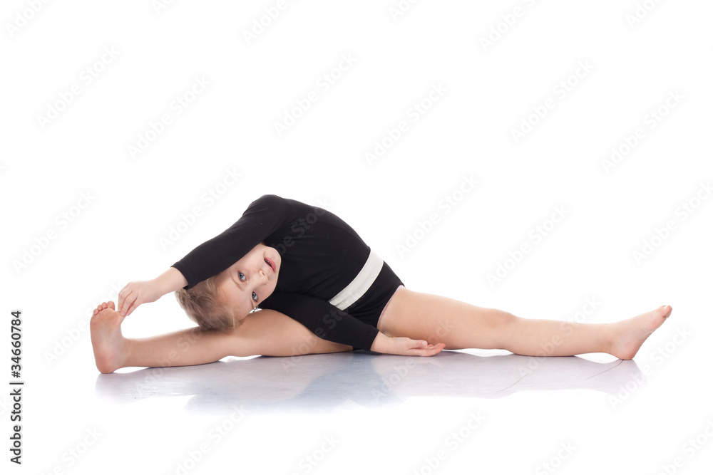 Studio portrait of girl gymnasts, stretching