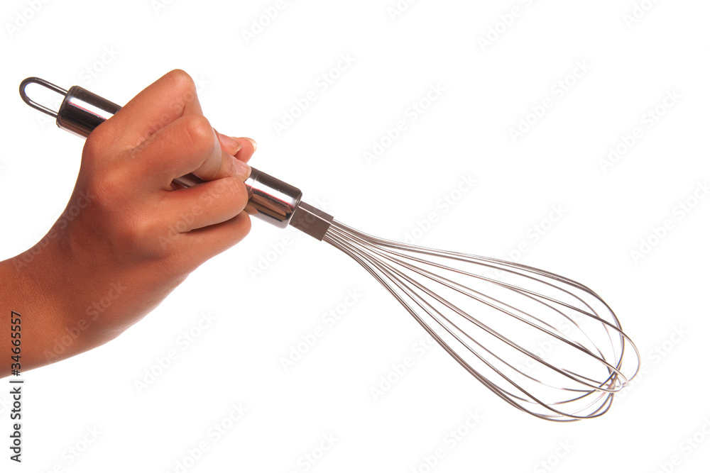 main qui tient un fouet de cuisine Photos | Adobe Stock